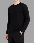 man wearing black long sleeve t-shirt with heavyweight and 100% cotton fabric, tailored fit