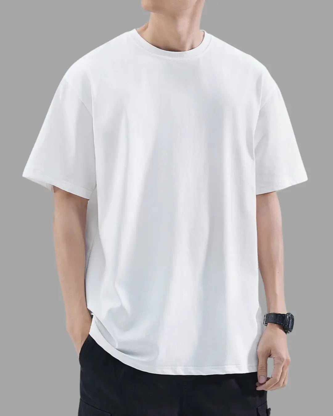 man wearing white t-shirt with oversized drop shoulder design, heavyweight 100% cotton fabric