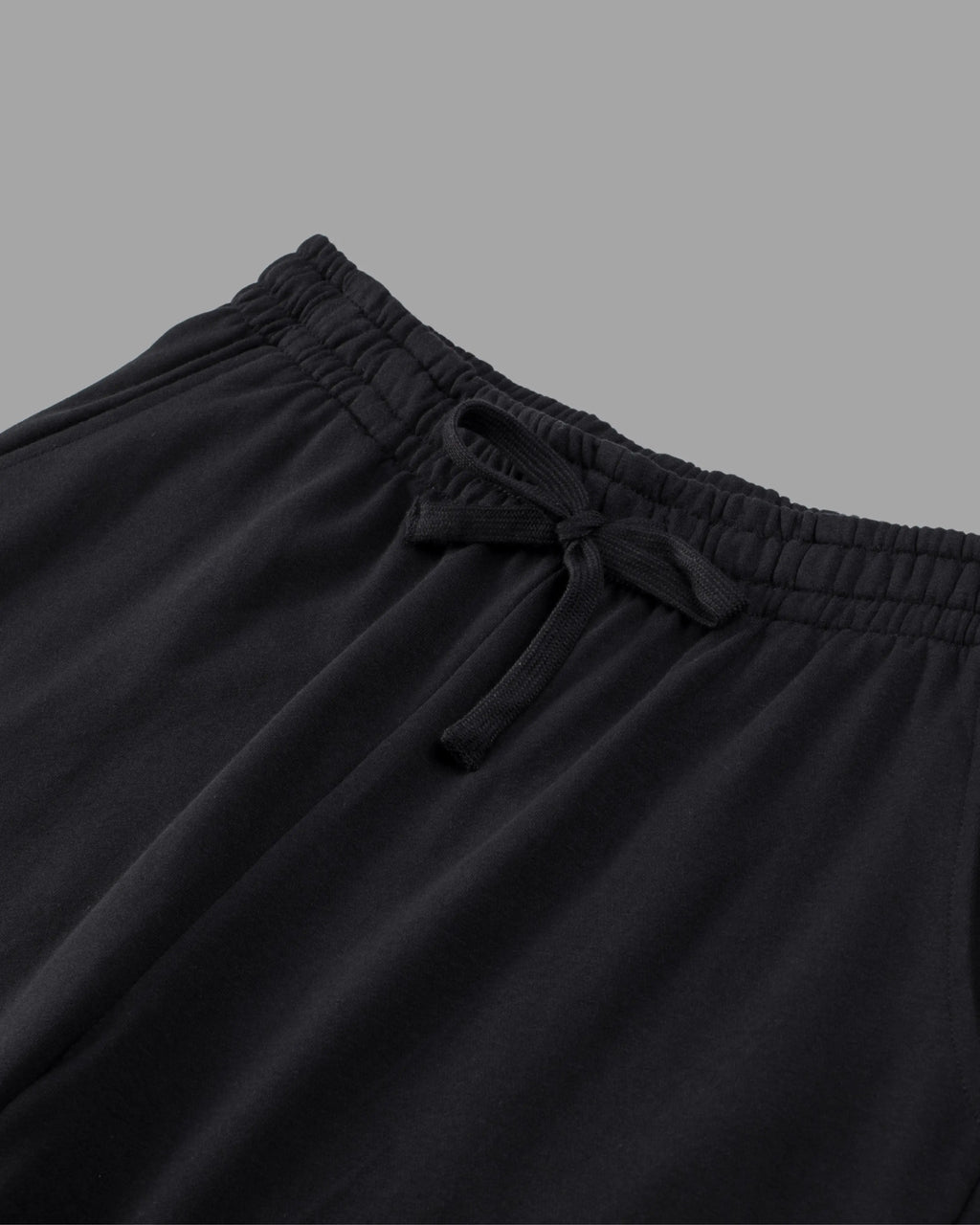 black cotton sweat shorts with draw string waist and deep pockets