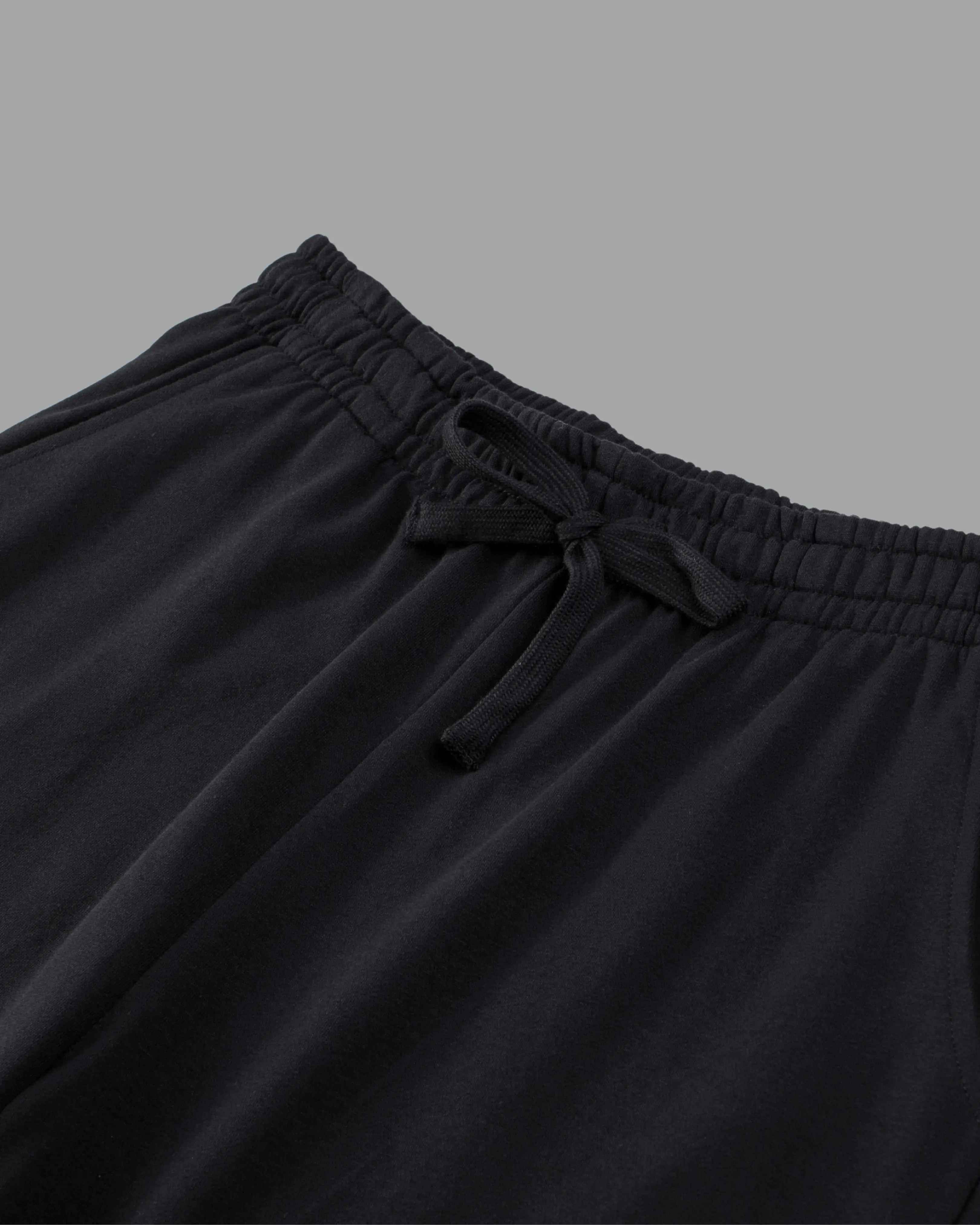 black cotton sweat shorts with draw string waist and deep pockets